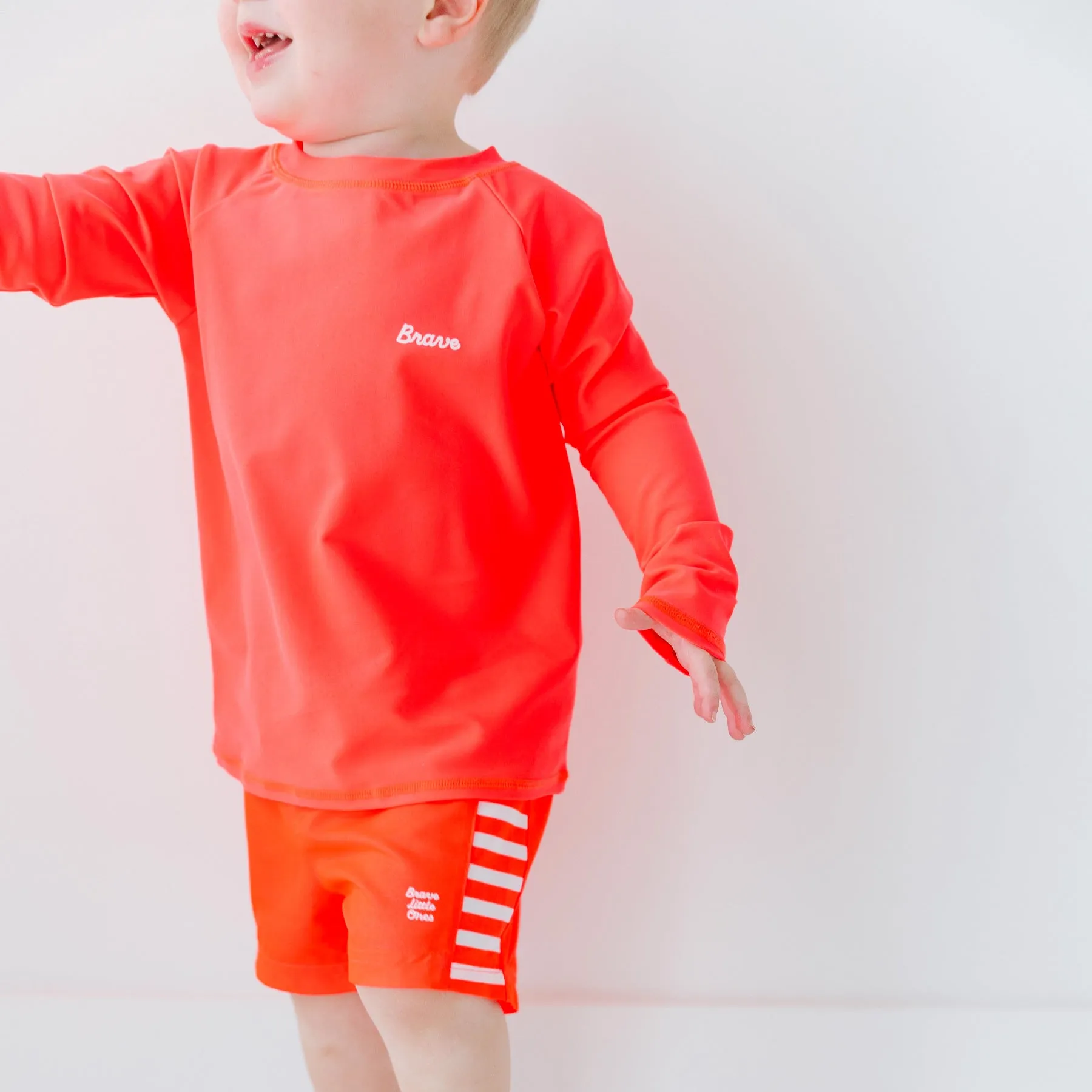 Neon Coral Stripe Swim Trunks