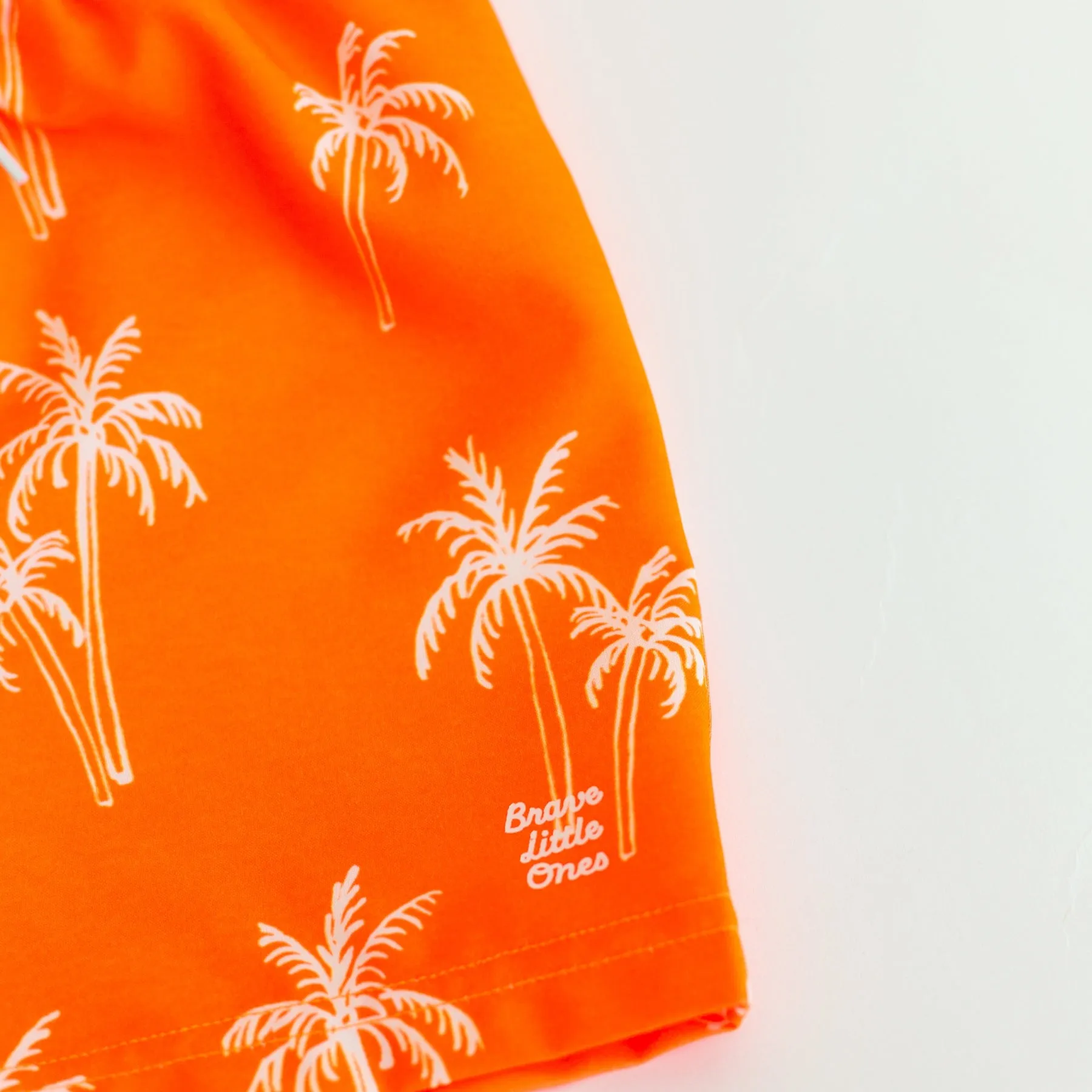 Neon Orange Palms Swim Trunks