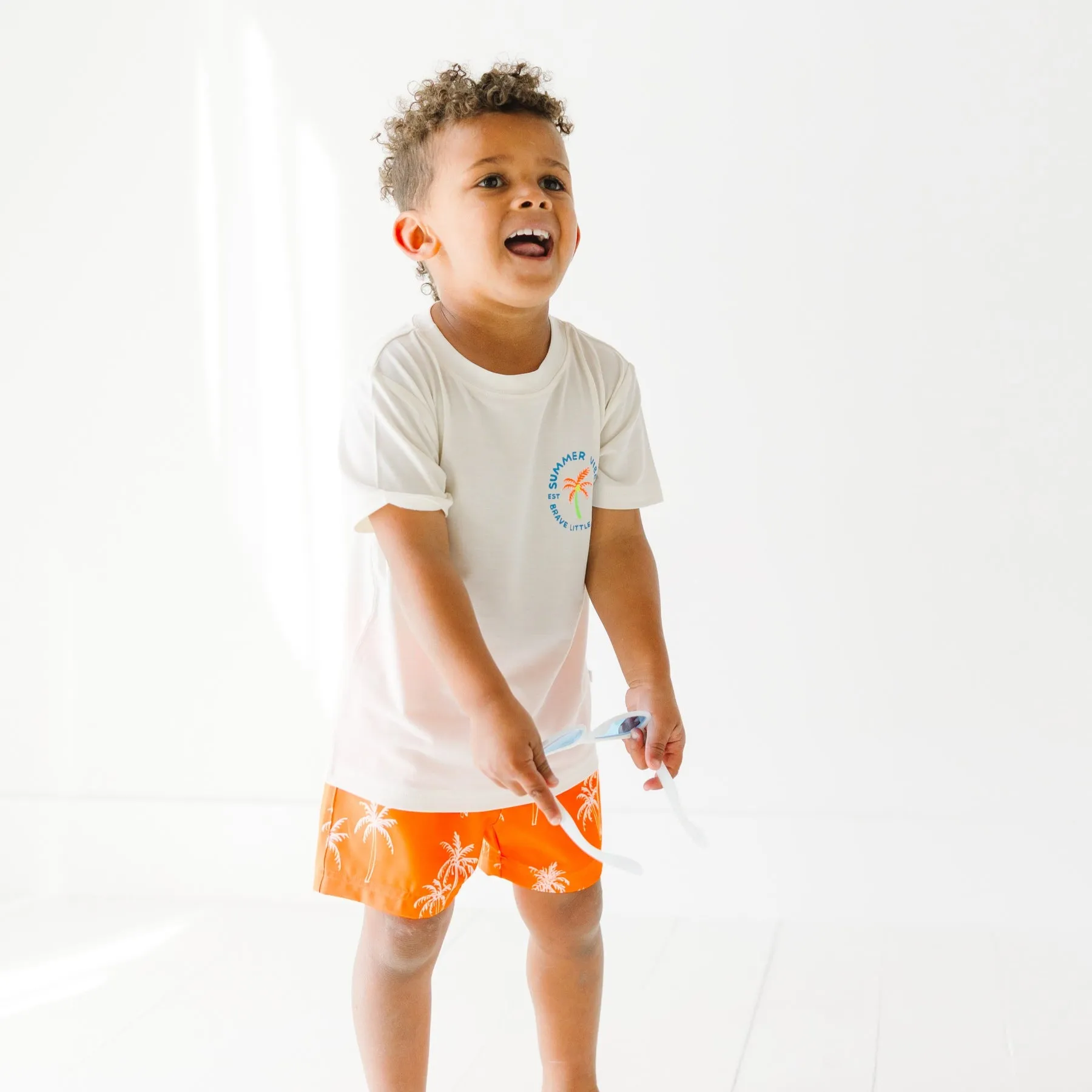 Neon Orange Palms Swim Trunks