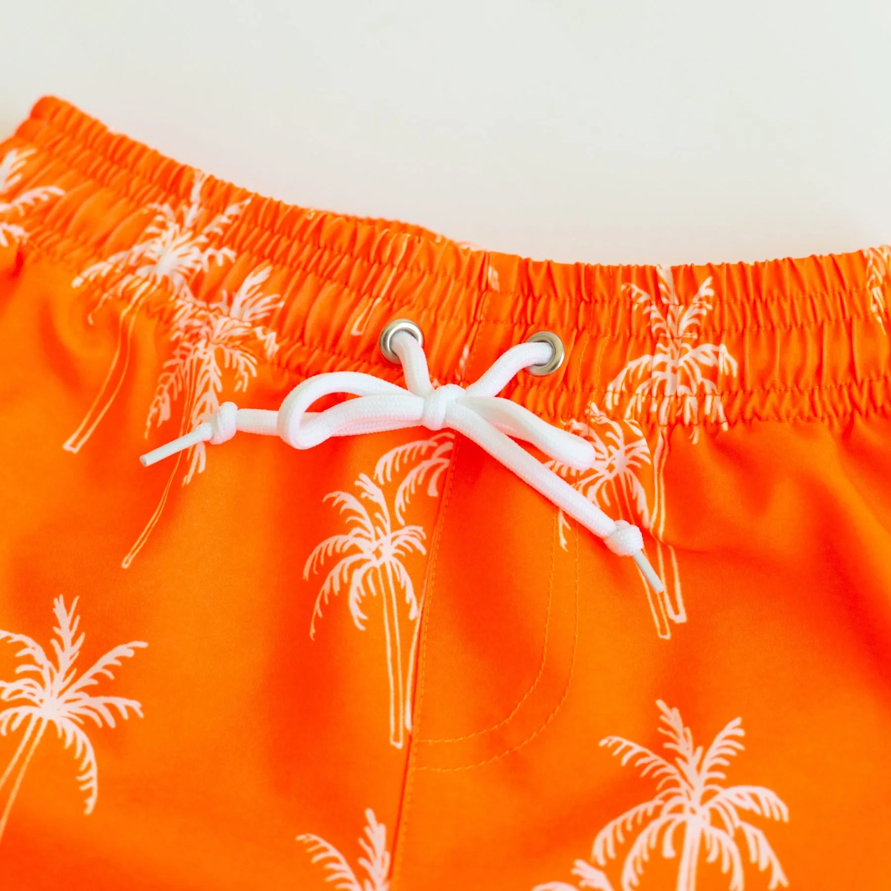 Neon Orange Palms Swim Trunks